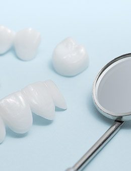 All ceramic dental restoration samples on table top