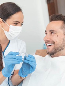 Dentist and patient discuss how much does Invisalign cost