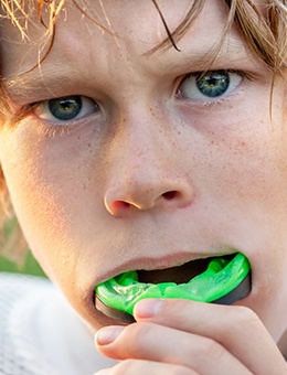 A young boy wears a mouthguard in Murphy to protect his teeth while on the field