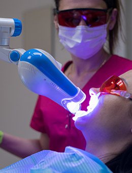 Patient receiving in office teeth whitening