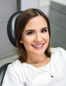 Female patient smiling in dental chair