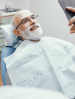 Man smiling at dentist in Murphy