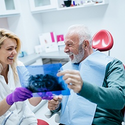 Older man visiting an implant dentist in Murphy
