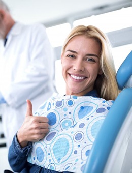 woman at a consultation with her dental implant dentist in Murphy, TX 
