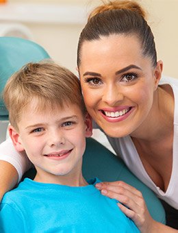 Mom and son smiling after children's dentistry visit