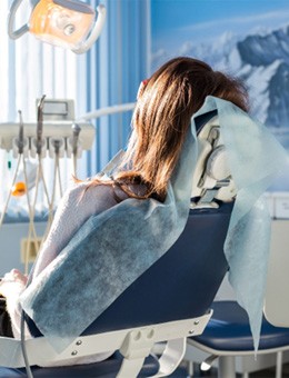 Female patient relaxing in a dental chair 