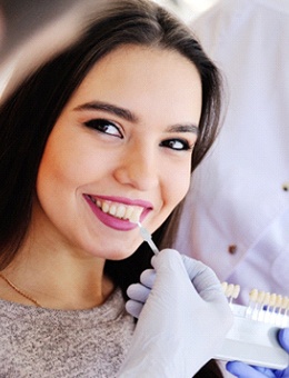 young woman smiling and getting veneers in Murphy